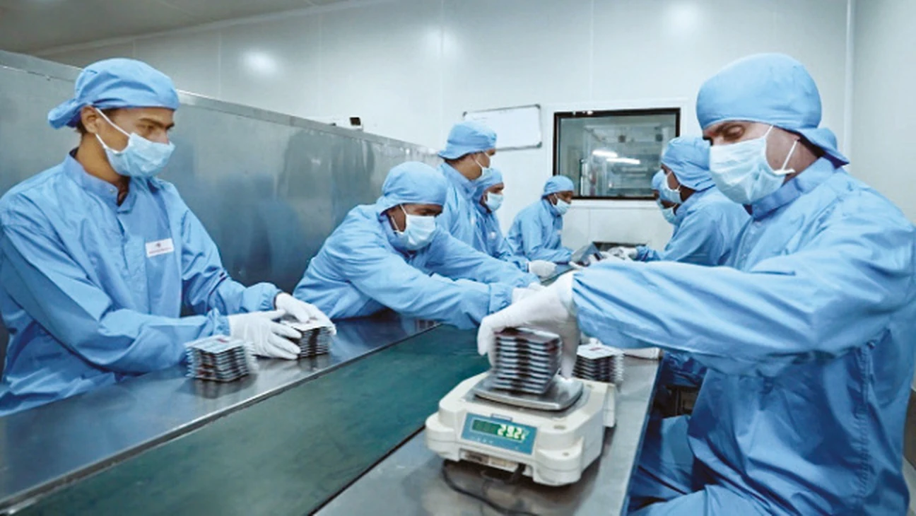 Packaging line under glass isolators with operators performing in-process checks
